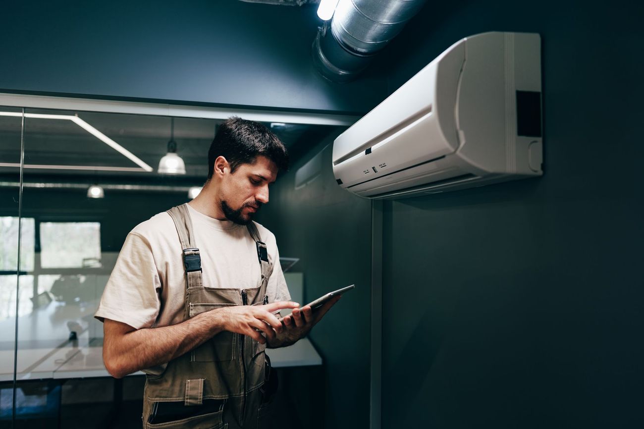 Rose Septic technician reviewing service report with customer